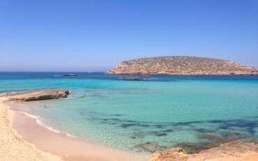 San Antonio, Ibiza. With three beautiful beach areas to explore and a dazzling backdrop, Cala Conta always feels like a discovery.